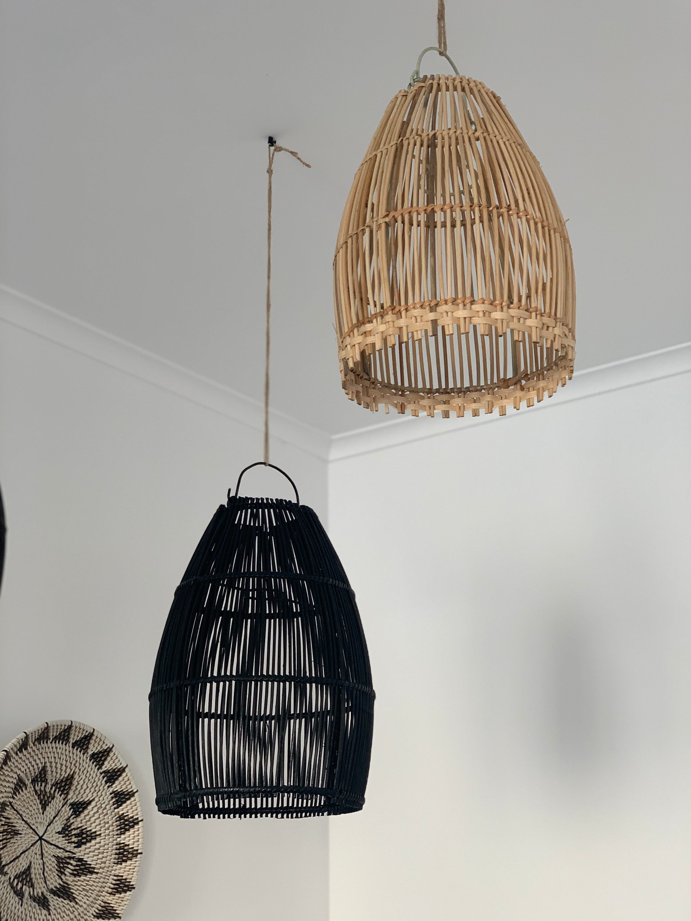 Ayana Black Rattan Lamp Shade hanging elegantly, showcasing its intricate handmade design and boho style.