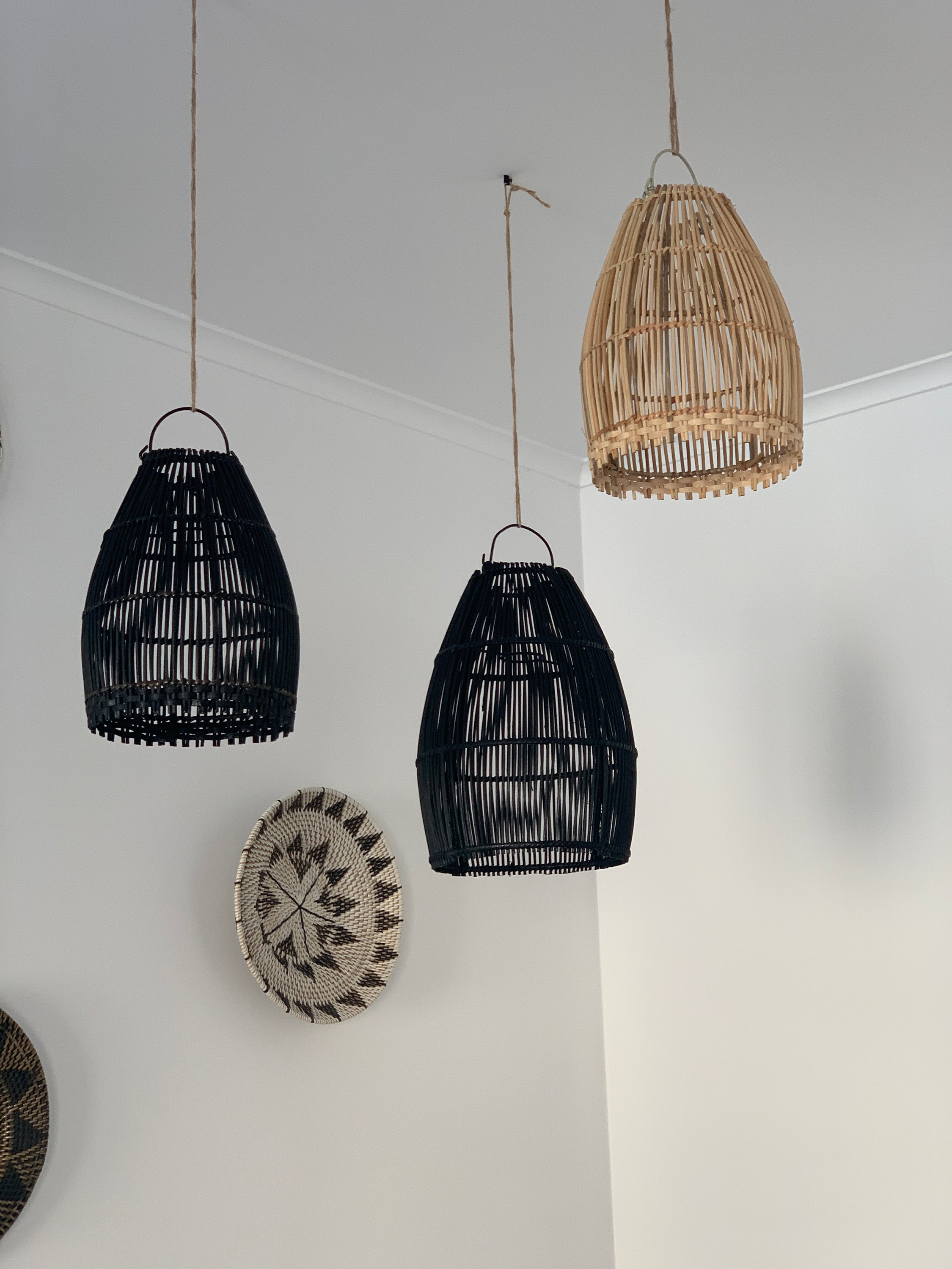 Ayana Black Rattan Lamp Shade hanging elegantly, showcasing its intricate handmade design and boho style.