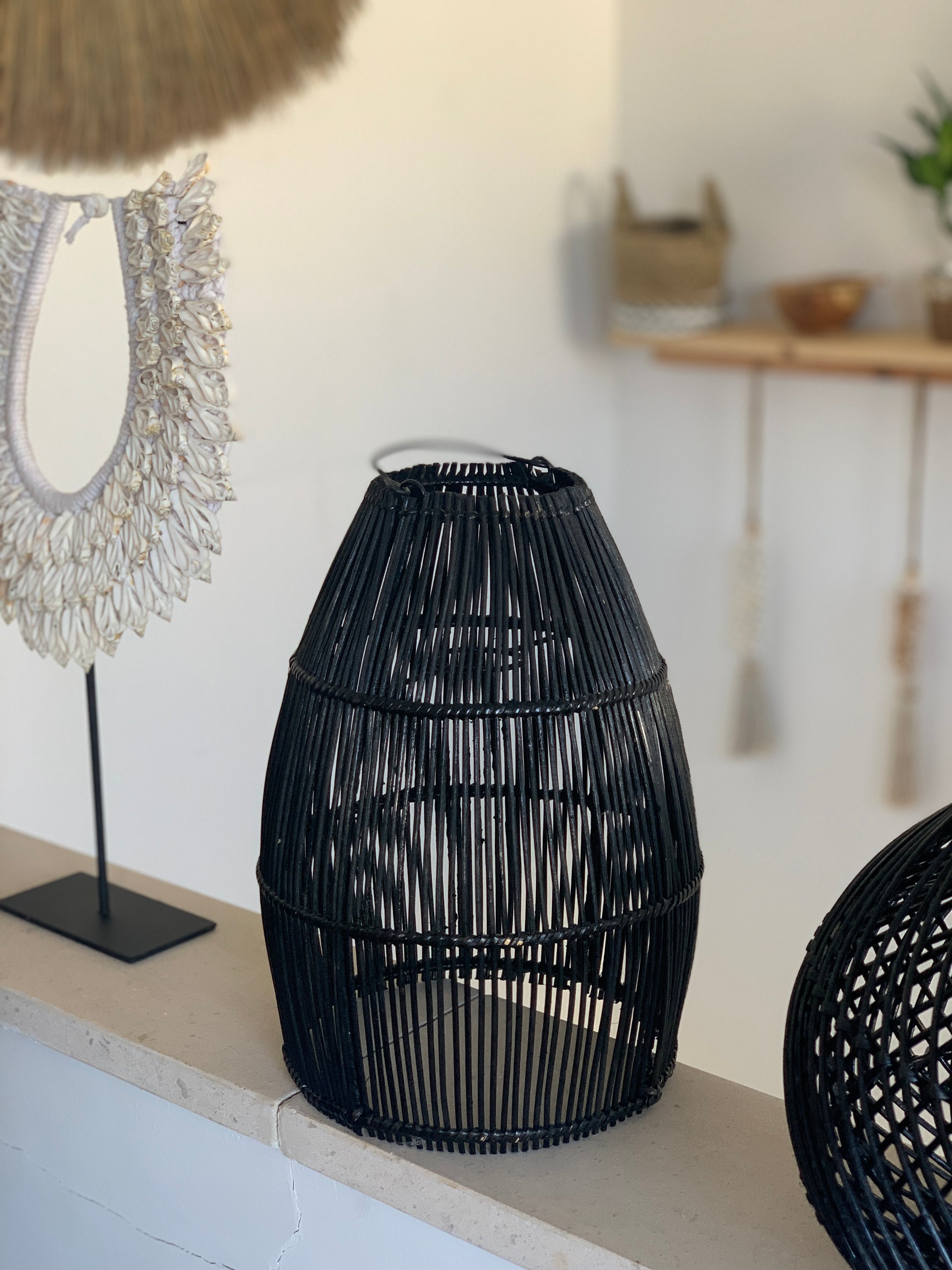 Ayana Black Rattan Lamp Shade hanging elegantly, showcasing its intricate handmade design and boho style.