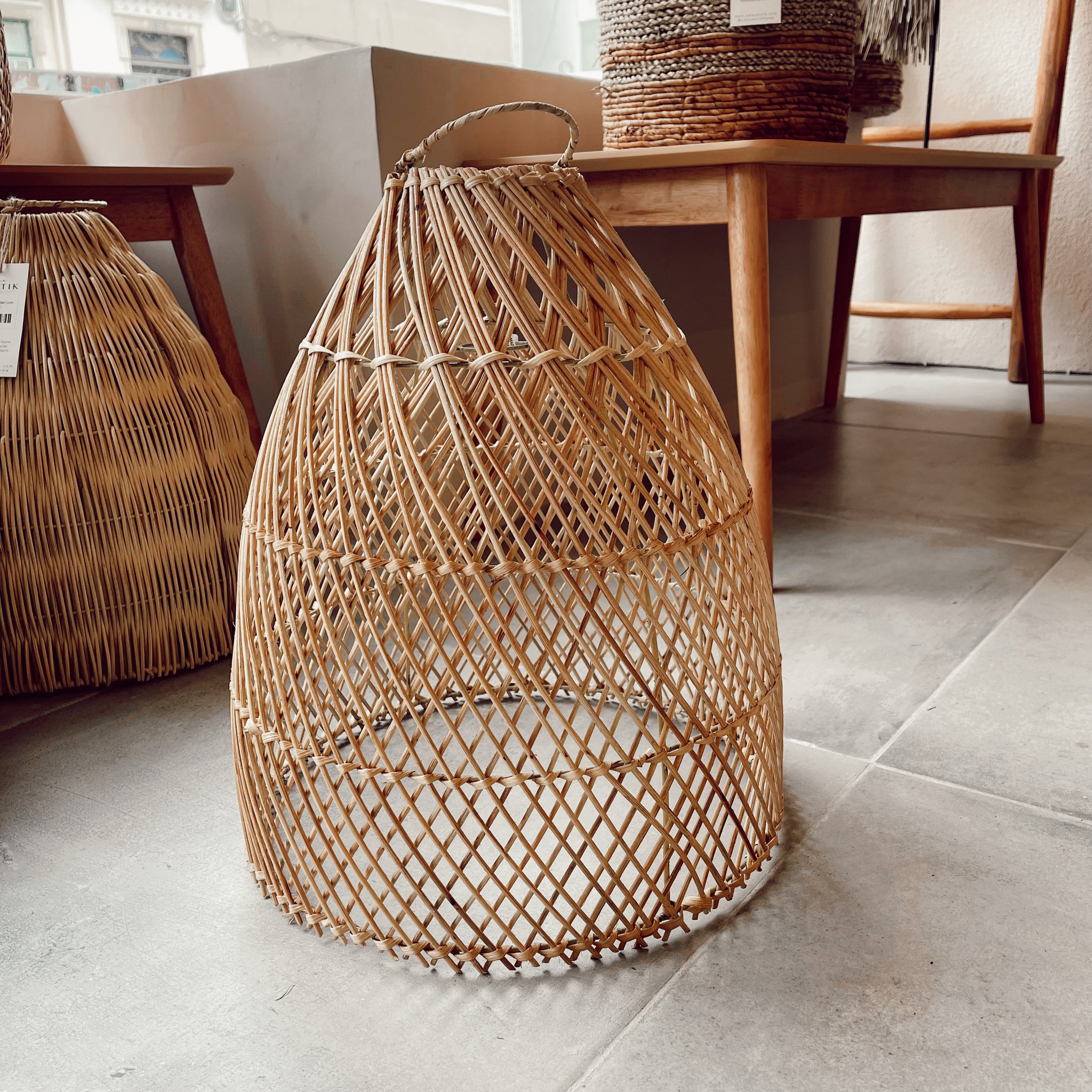 Laga Natural Rattan Lampshade hanging elegantly, showcasing its intricate handmade design and natural texture.