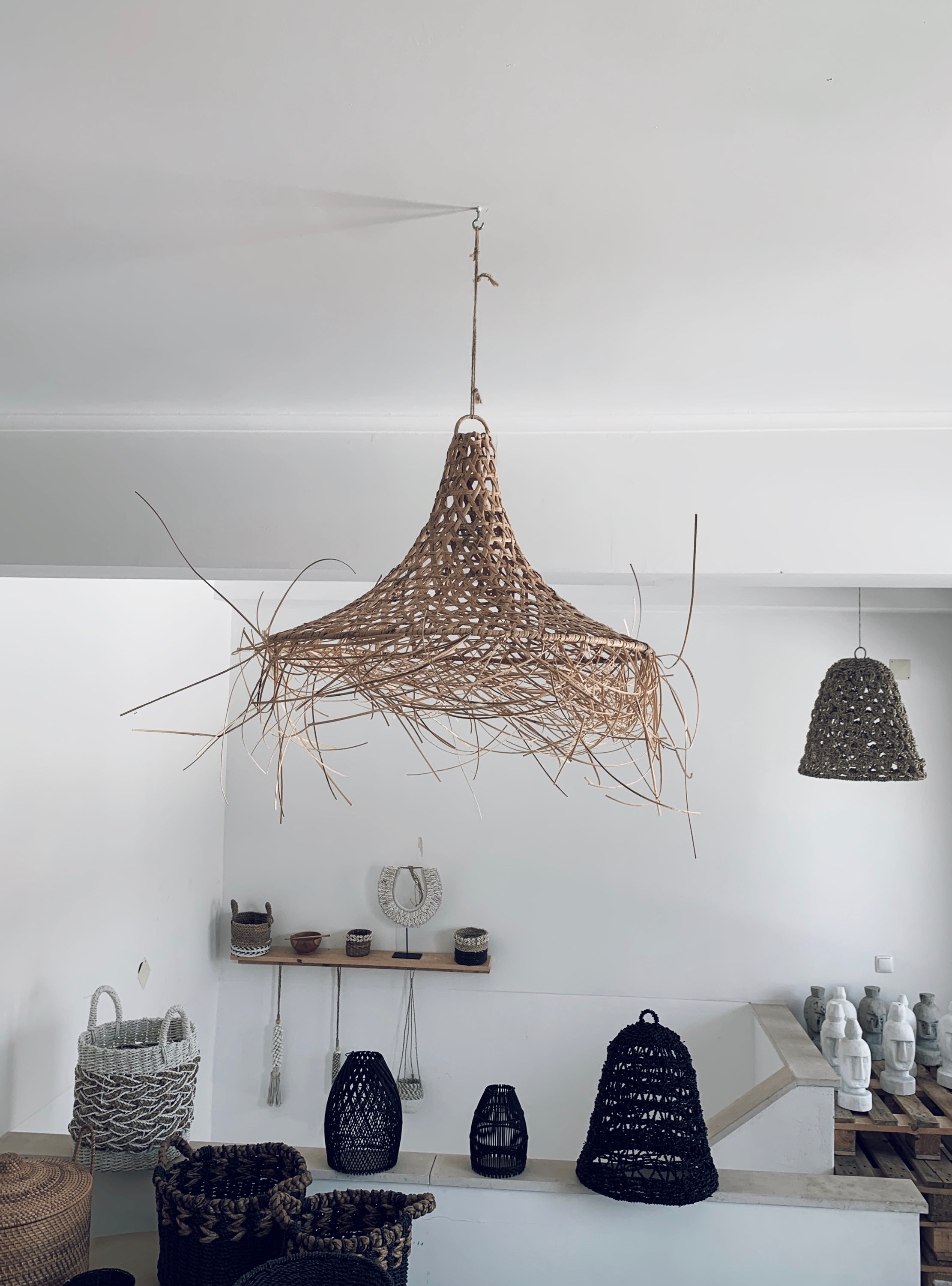 Mangsit Rattan Lampshade showcasing intricate Balinese weaving patterns, perfect for coastal and traditional interiors.