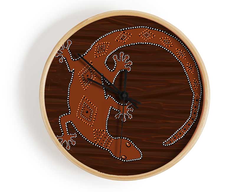 Aboriginal Lizard 2 clock made from natural bamboo with a round face and clear Plexiglas lens, available in black, white, and natural frame colors.