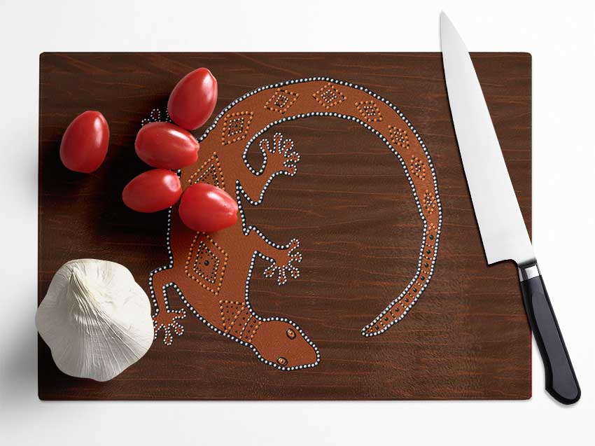 Aboriginal Lizard 2 chopping board made of tempered glass with a chinchilla ripple effect and anti-slip feet.