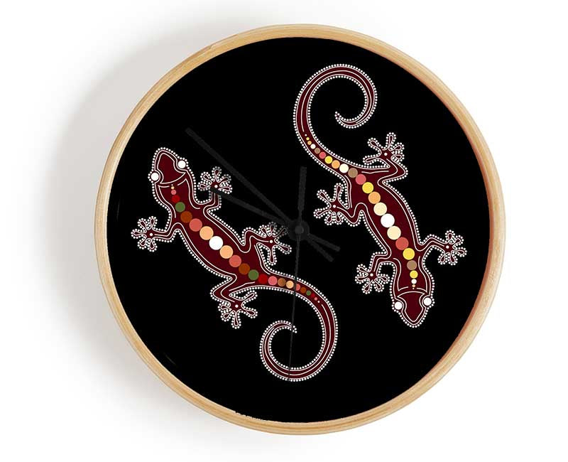 Aboriginal Lizard 4 clock made from natural bamboo with a round face and clear Plexiglas lens, available in black, white, and natural frame colors.