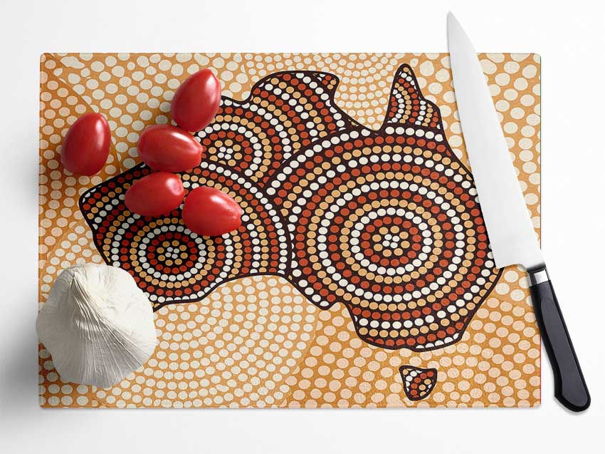 Aboriginal Map chopping board made from tempered glass with a chinchilla ripple effect and anti-slip feet.