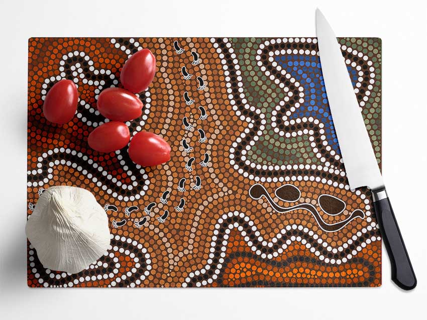 Aboriginal Pattern 5 chopping board made from tempered glass with a chinchilla ripple effect and anti-slip feet.