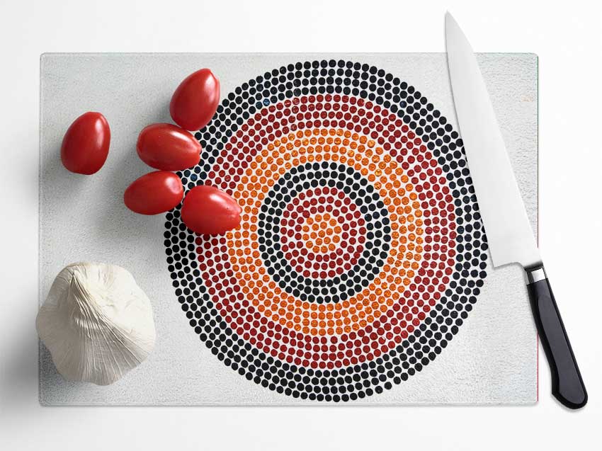 Aboriginal Pattern 7 chopping board made of tempered glass with a unique chinchilla ripple effect and anti-slip feet.