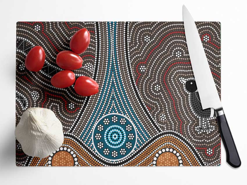 Aboriginal Pattern 8 chopping board made of tempered glass with chinchilla ripple effect and anti-slip feet.