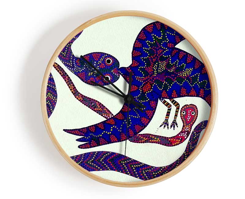 Aboriginal Snake Bird clock made from natural bamboo with a round face and clear Plexiglas lens, available in black, white, and natural frame colors.