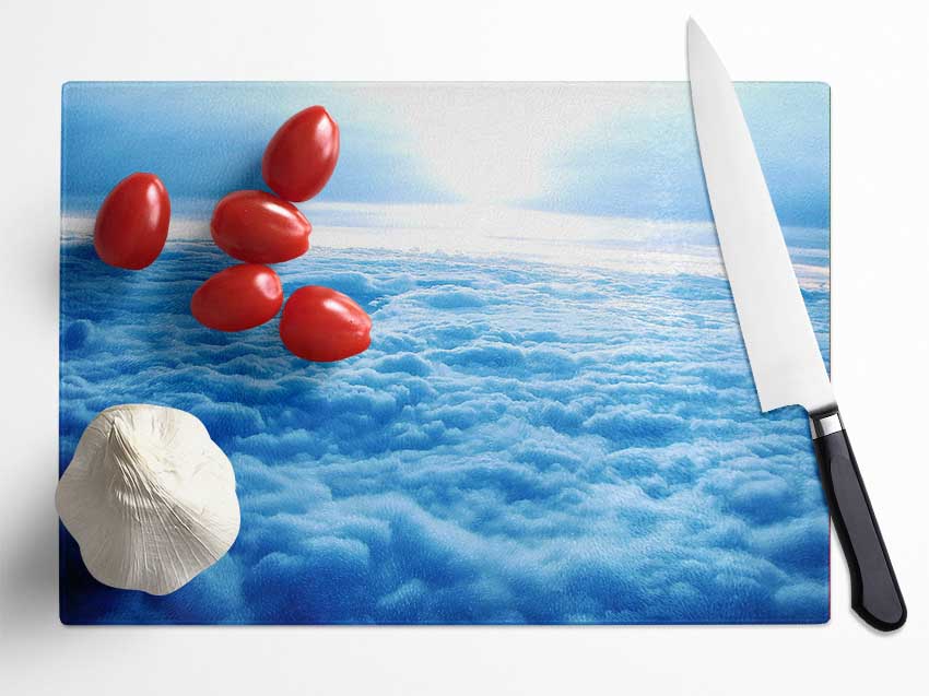 Above The Clouds chopping board made of tempered glass with a chinchilla ripple effect and anti-slip feet.