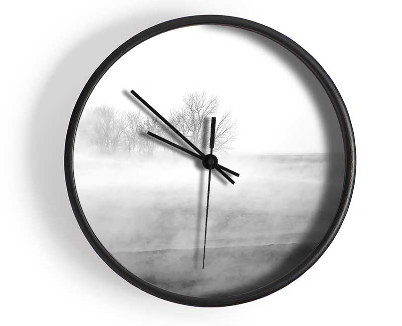 Stylish Absorption B n W clock made from natural bamboo with a round face and clear Plexiglas lens, available in black, white, and natural colors.