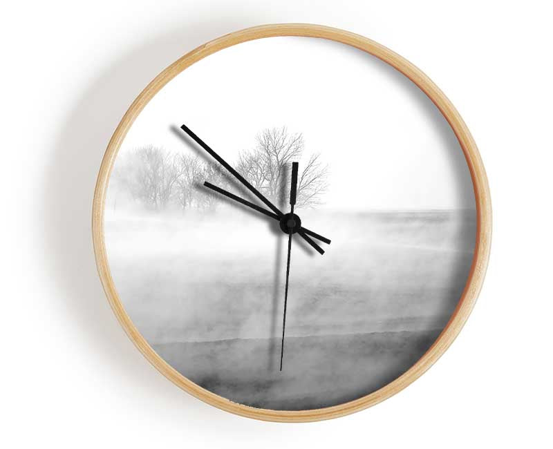 Stylish Absorption B n W clock made from natural bamboo with a round face and clear Plexiglas lens, available in black, white, and natural colors.