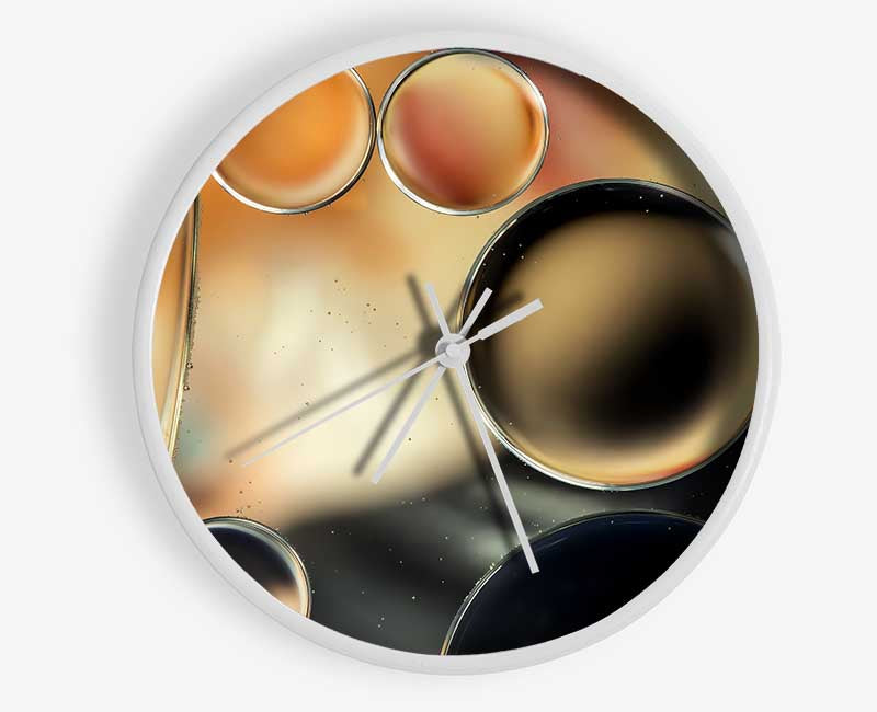 Abstract Circles Droplets clock made of natural bamboo with a round face and clear Plexiglas lens, available in black, white, and natural frame colors.