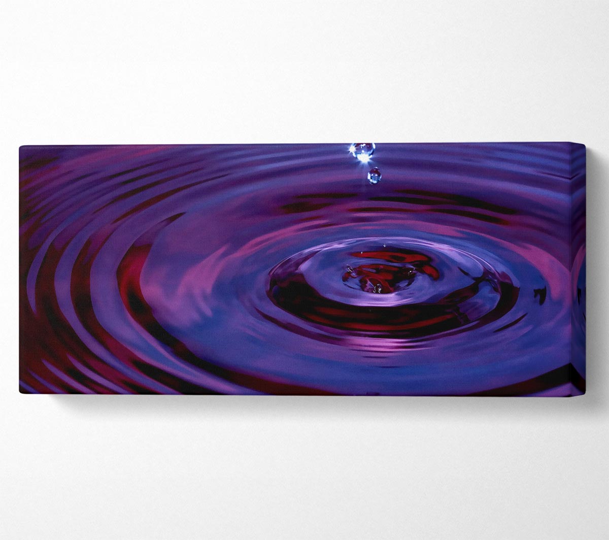 Abstract Drop canvas art mounted on a 44mm box frame, showcasing vibrant colors and a modern design.