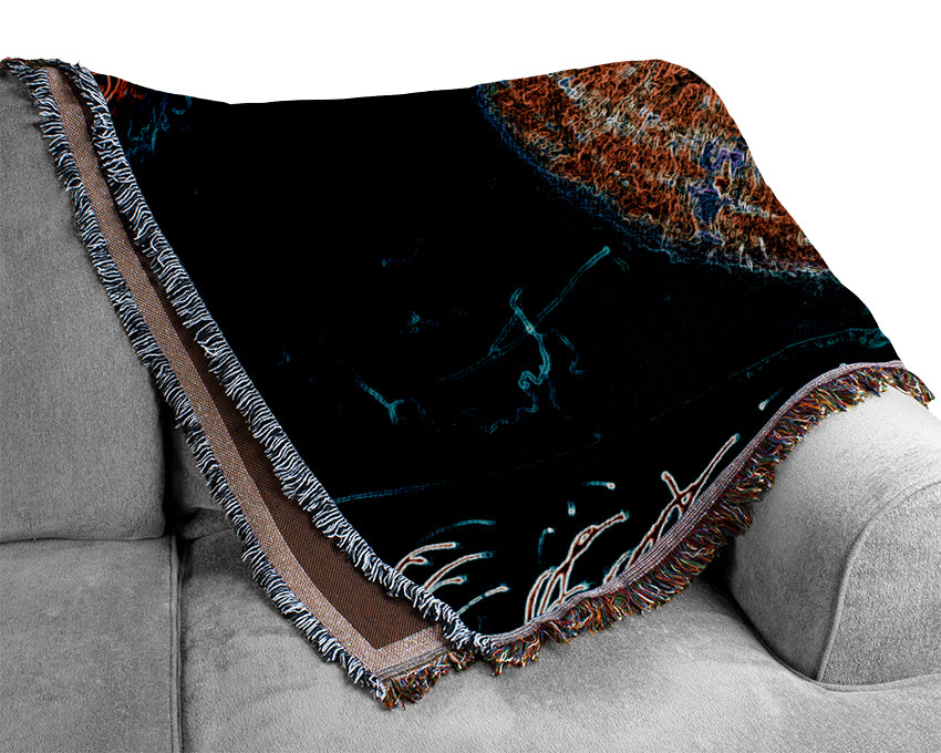 A luxurious Abstract Eye throw blanket made from 100% cotton, featuring a thermal weave design, draped elegantly over a couch.