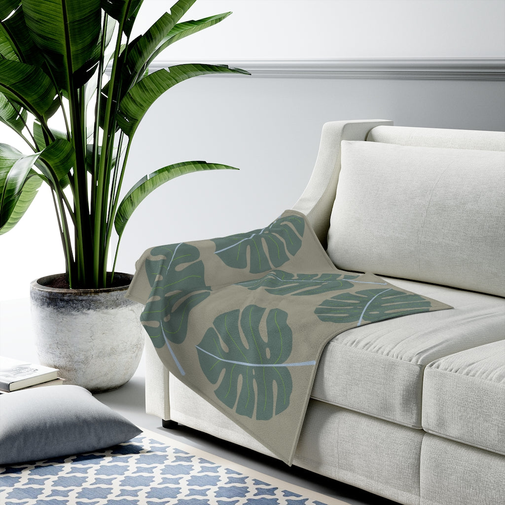 Abstract Leaves Green Plush Blanket Throw showcasing soft velveteen fabric with a stylish leaf design, perfect for cozy home decor.