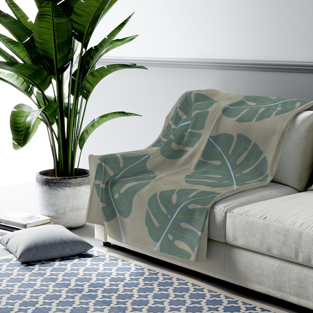 Abstract Leaves Green Plush Blanket Throw showcasing soft velveteen fabric with a stylish leaf design, perfect for cozy home decor.