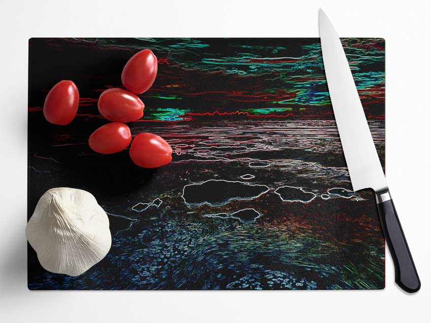 Abstract Neon Seascape chopping board made of tempered glass with a vibrant design and anti-slip feet.