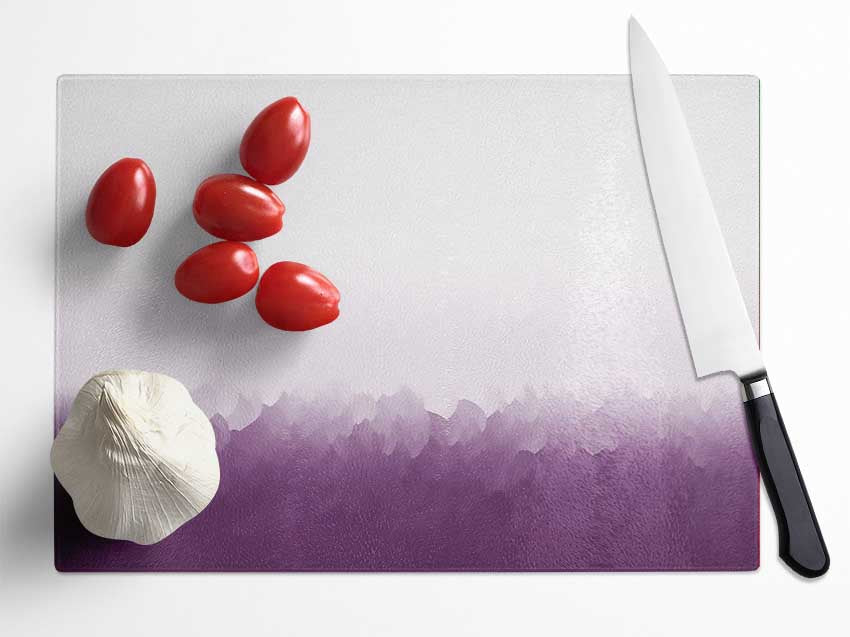 Abstract Ocean Lilac On White chopping board made of tempered glass with a stylish design and anti-slip feet.