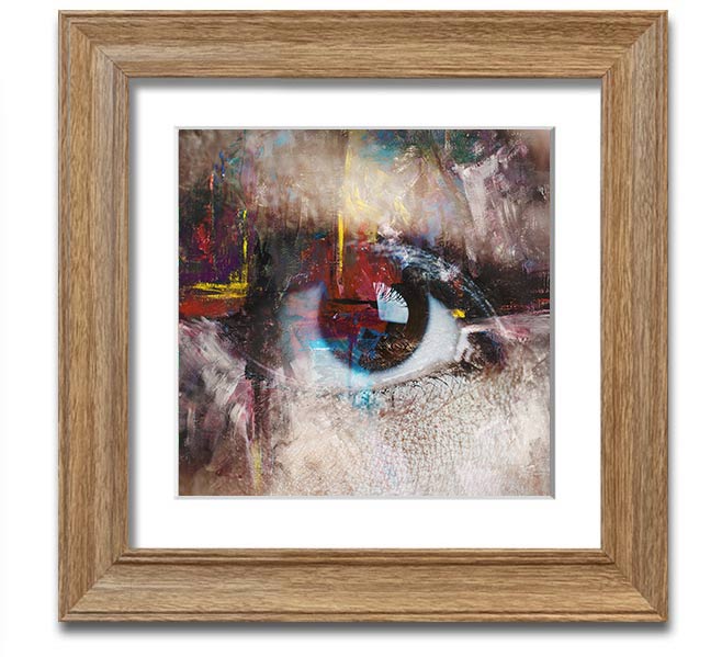 A square framed print featuring an abstract painting with an eye motif, showcasing vibrant colors and intricate details, ready to hang.