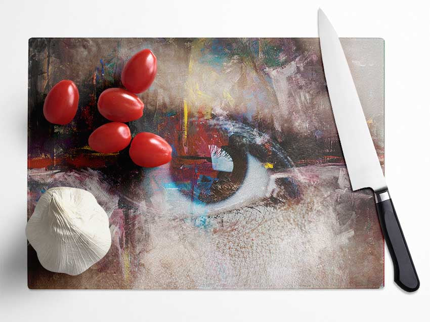 Abstract Painting and Eye chopping board made of tempered glass with artistic design and anti-slip feet.