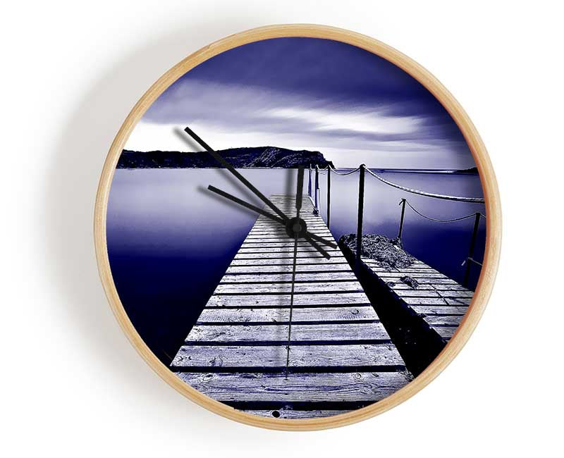 Abstract Pier Purple clock made from natural bamboo with a round face and clear Plexiglas lens, available in multiple colors.