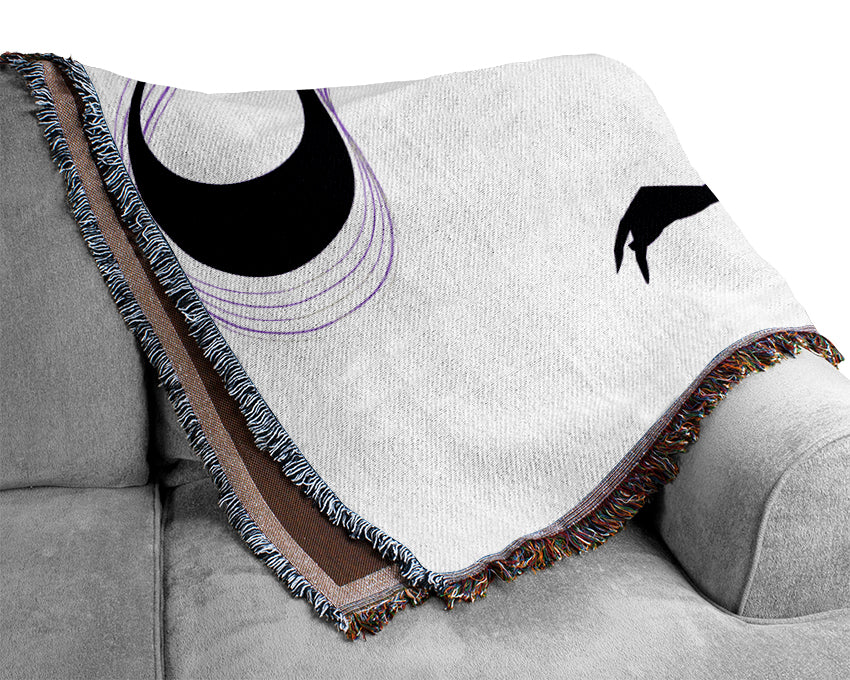 Blanket with moon and hand design.