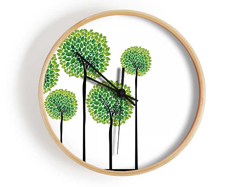 Abstract Trees clock made from natural bamboo with a round face and clear Plexiglas lens, available in black, white, and natural frame colors.