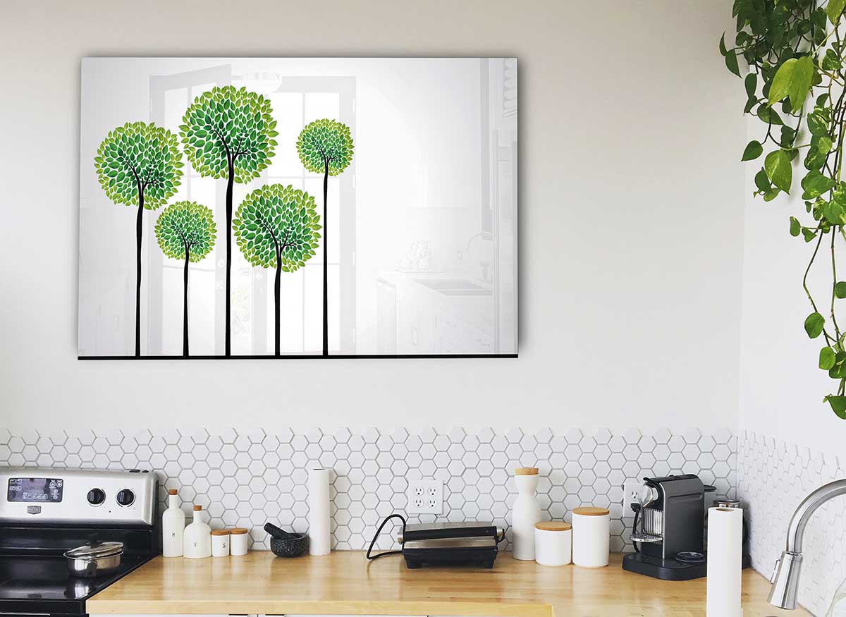 A modern glass print featuring abstract trees, showcasing vibrant colors and intricate details, perfect for home decor.