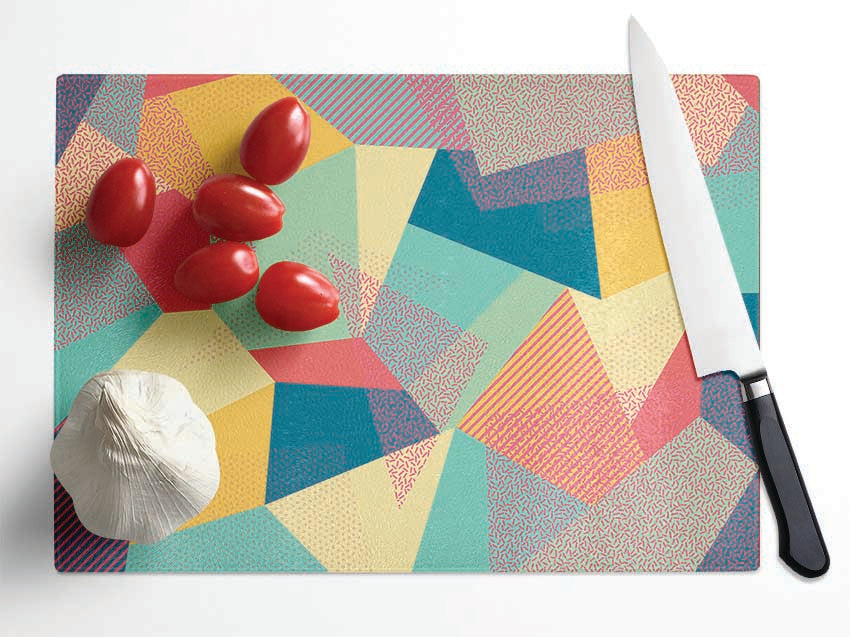 Abstract Triangles chopping board made of tempered glass with a chinchilla ripple effect and anti-slip feet.