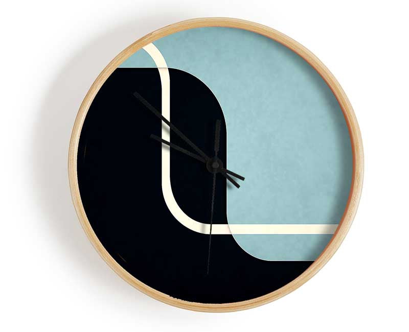 Abstract Yin Yang clock made from natural bamboo with a round face and clear Plexiglas lens, available in black, white, and natural frame colors.