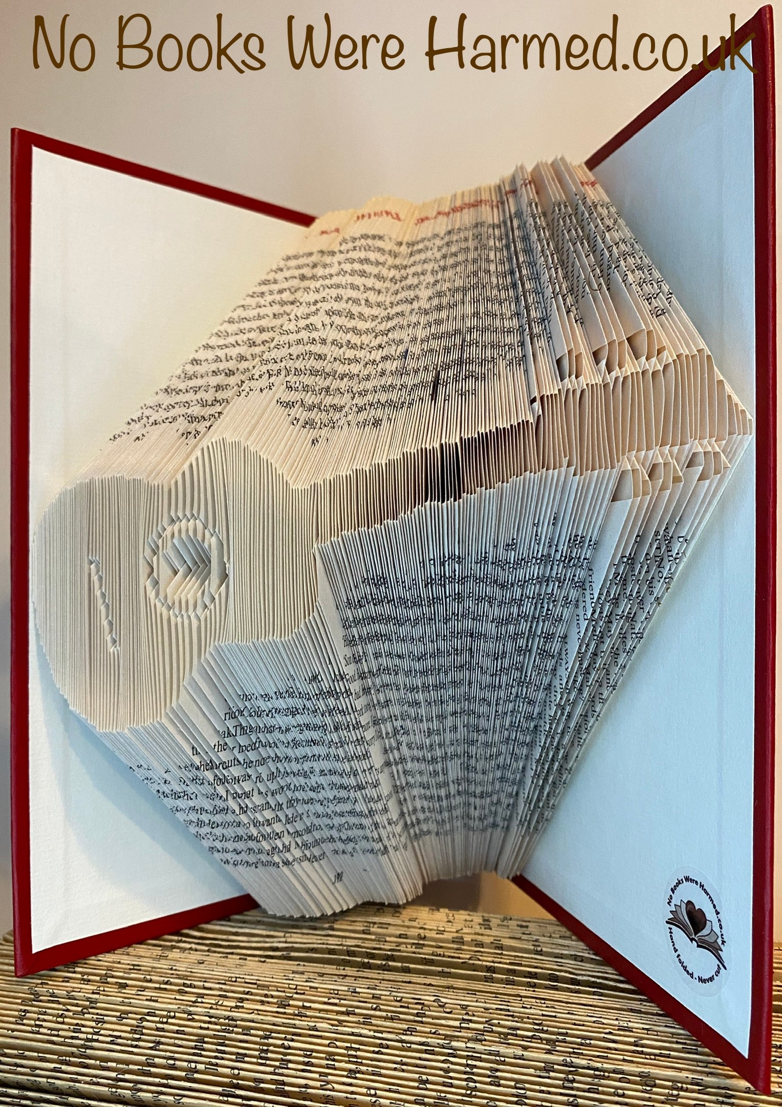 Handcrafted Acoustic Guitar art made from vintage book pages, showcasing intricate folds and unique design.