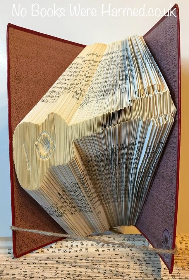 Handcrafted Acoustic Guitar art made from vintage book pages, showcasing intricate folds and unique design.