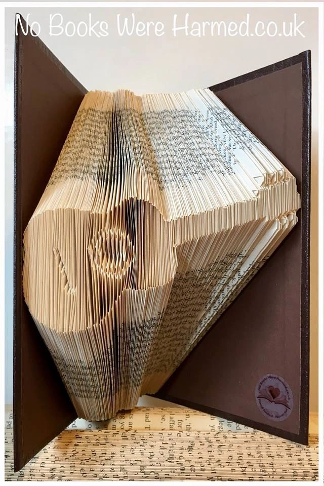 Handcrafted Acoustic Guitar art made from vintage book pages, showcasing intricate folds and unique design.