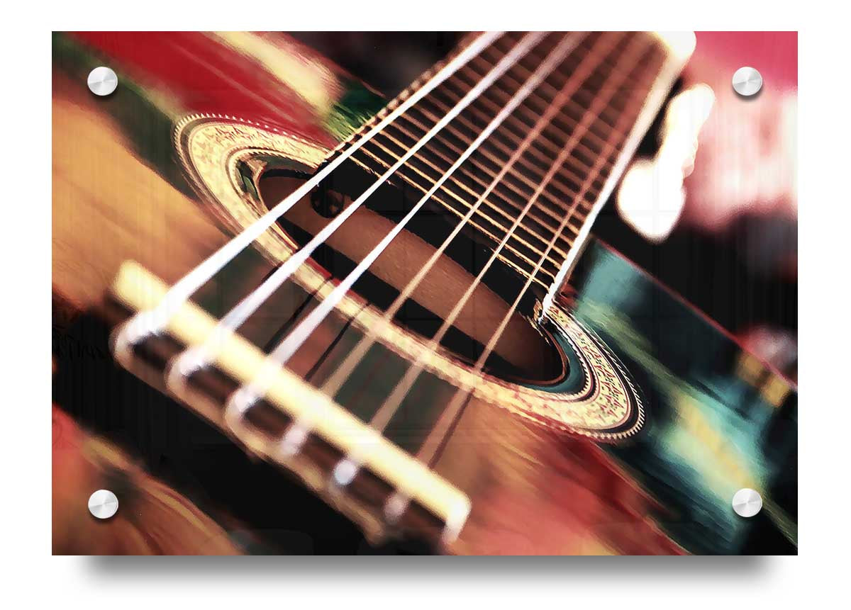 A vibrant acrylic print of an acoustic guitar, showcasing intricate details and colors, ready to hang on the wall.