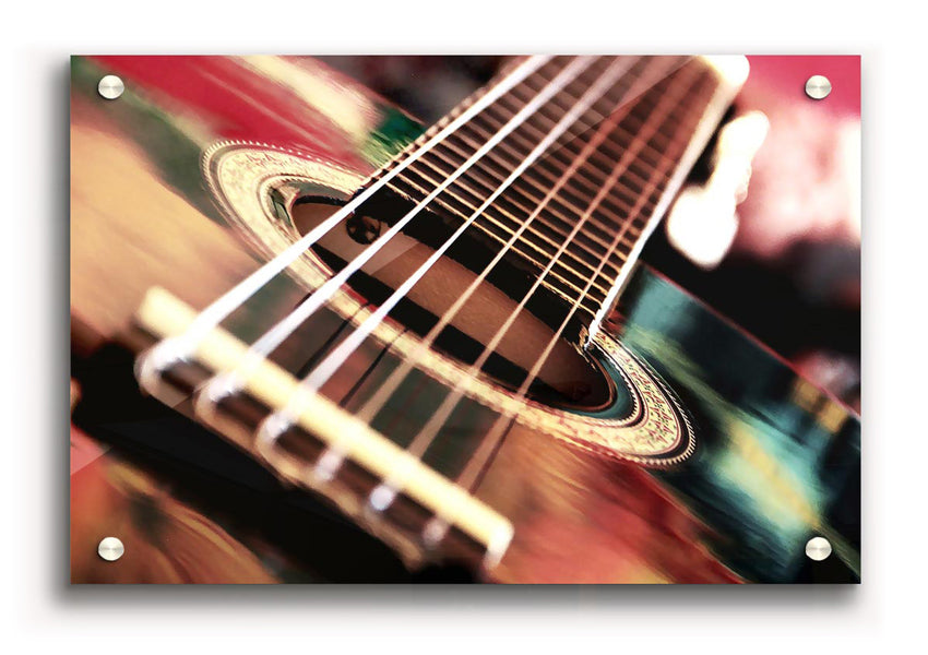 A vibrant acrylic print of an acoustic guitar, showcasing intricate details and colors, ready to hang on the wall.