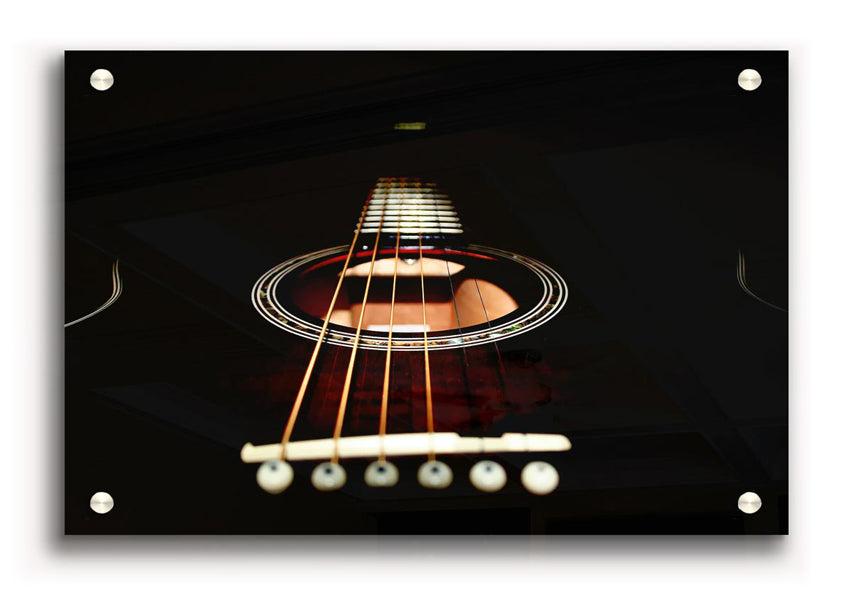 Close-up view of an acoustic guitar printed on acrylic glass, showcasing vibrant colors and intricate details.