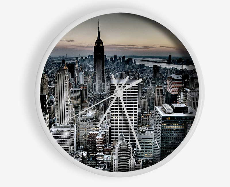 A stylish bamboo wall clock with a round face, available in black, white, and natural frame colors, featuring a clear Plexiglas lens.