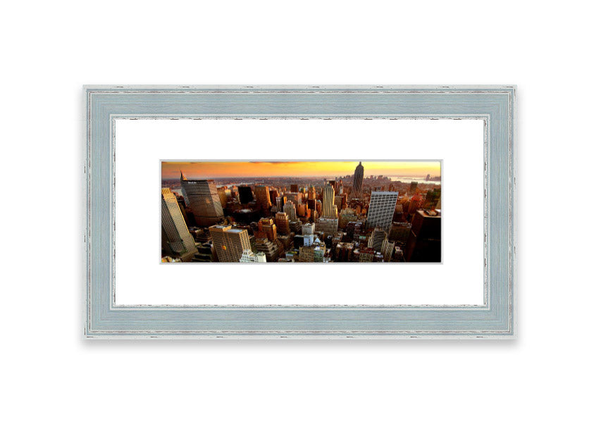 Framed print of an aerial view of New York City, showcasing the iconic skyline and vibrant cityscape.