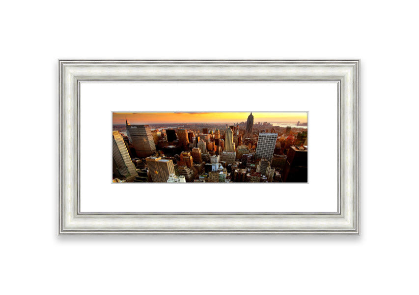 Framed print of an aerial view of New York City, showcasing the iconic skyline and vibrant cityscape.