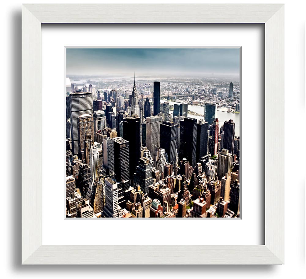 Aerial view of New York City captured in a square framed print, showcasing the iconic skyline and vibrant cityscape.