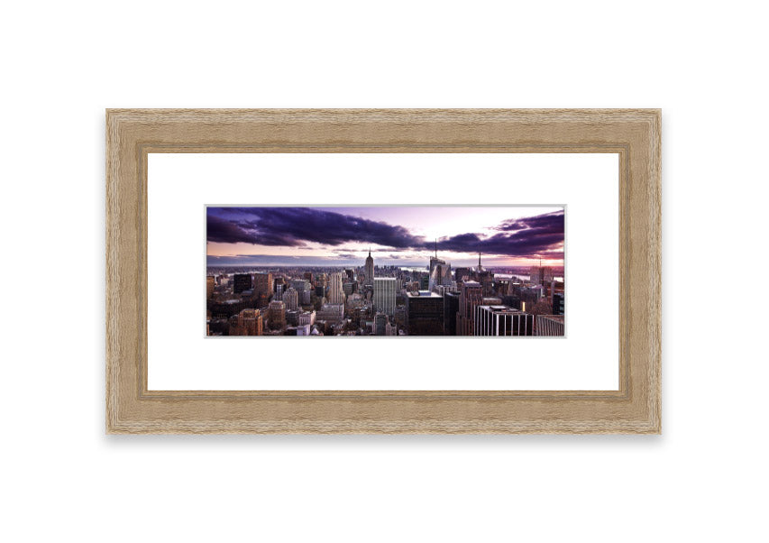 Framed print of New York City skyline at dusk, showcasing vibrant colors and intricate details.