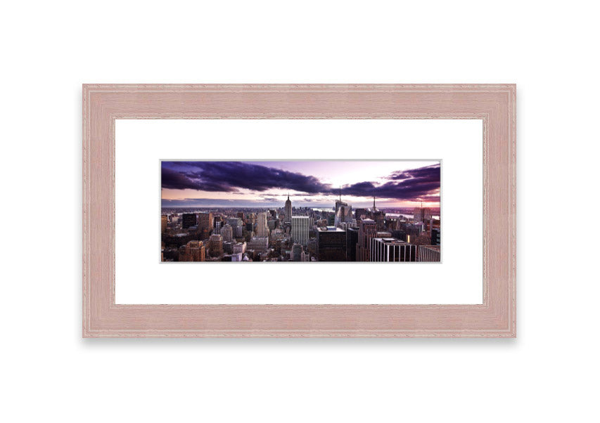 Framed print of New York City skyline at dusk, showcasing vibrant colors and intricate details.