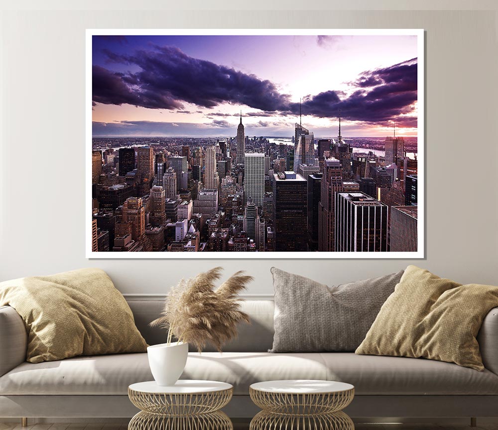 Aerial view of New York City skyline at dusk, showcasing vibrant colors and iconic buildings.