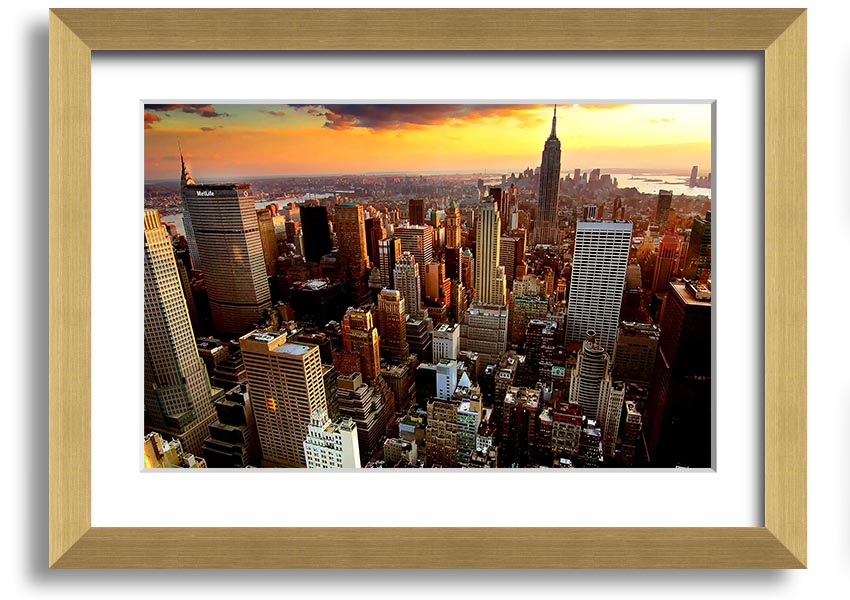 Aerial view of New York City at sunset, showcasing vibrant colors and iconic skyline, framed and ready to hang.