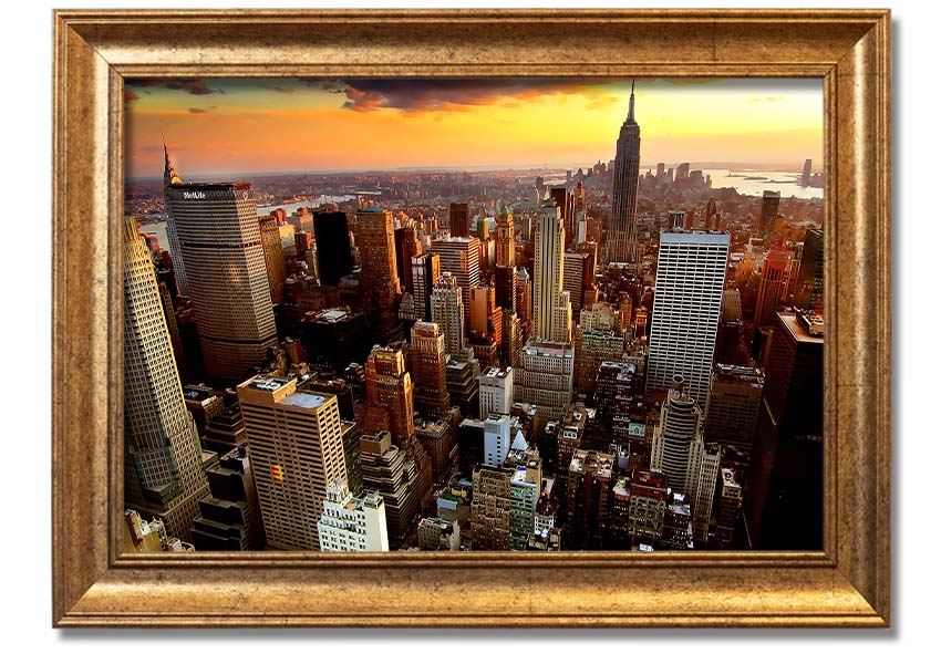 Aerial view of New York City at sunset, showcasing vibrant colors and iconic skyline, framed and ready to hang.