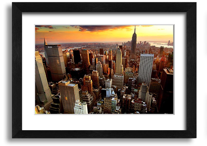 Aerial view of New York City at sunset, showcasing vibrant colors and iconic skyline, framed and ready to hang.