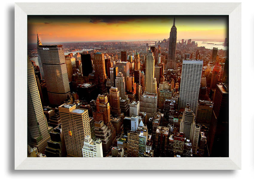 Aerial view of New York City at sunset, showcasing vibrant colors and iconic skyline, framed and ready to hang.