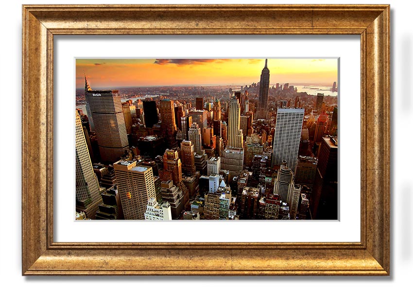 Aerial view of New York City at sunset, showcasing vibrant colors and iconic skyline, framed and ready to hang.