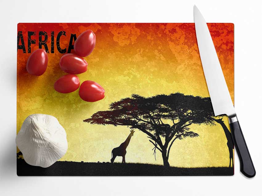 A stylish Africa chopping board made from durable tempered glass with a chinchilla ripple effect and anti-slip feet.